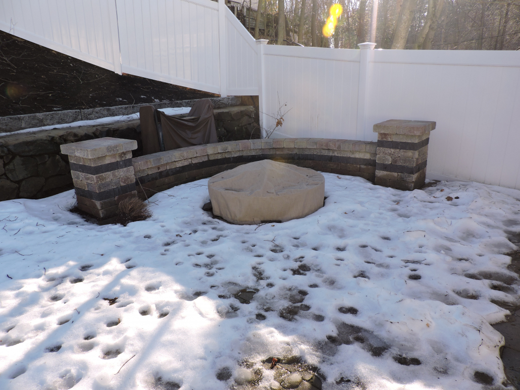 custom designed and fitted fabric cover for fire pit at Boston MA home in winter